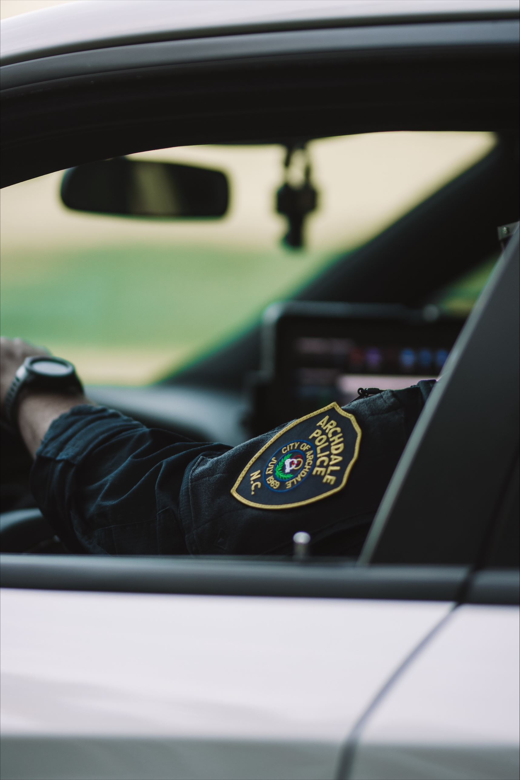 officer in patrol vehicle